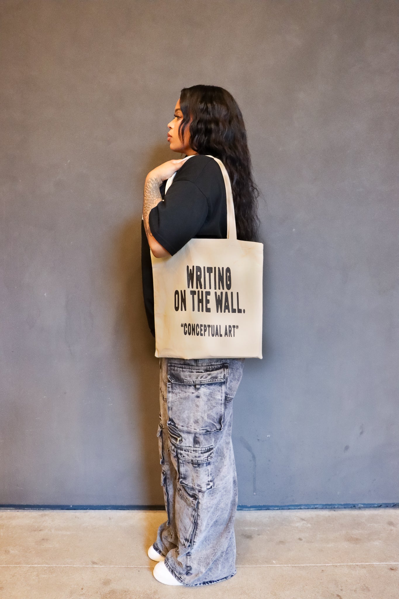 Writing on the wall tote bag